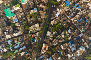 Aerial view of Kolkata at sunrise, capital city of West Bengal abd major Indian metropolis, also known as Calcutta. Panoramic drone shot of the old city center.
