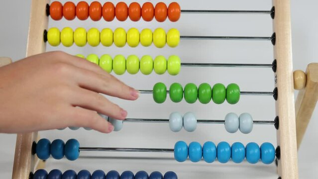 Hands Using Abacus on White Background