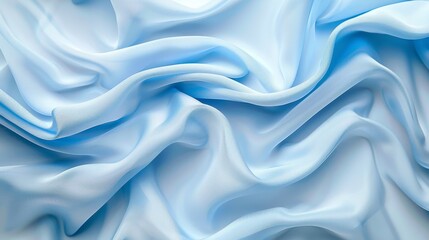 Obraz premium A pastel blue background is complemented by the texture of folded fabric