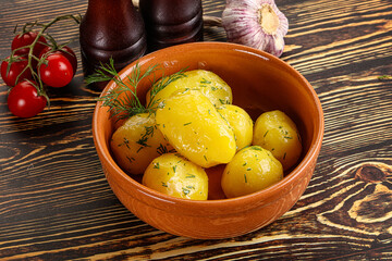 Boiled potato with oil and dill