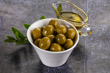Ripe tasty green olives with branch