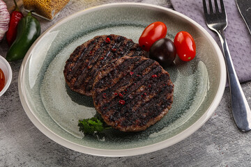 Grilled burger cutlet with sauce