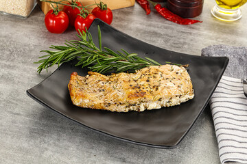 Baked salmon fish served rosemary