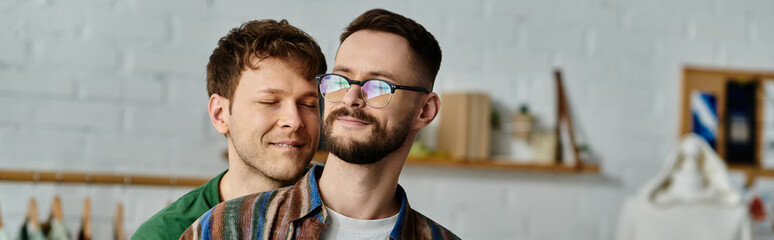 Two men, a gay couple, stand side by side in a designer workshop, passionately crafting trendy...