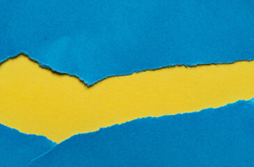 破れた青色と黄色の紙の背景