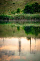 Obraz premium Summer river at morning . Forest on anothe beach. Fog on the water . Green forest . Reflections on the water . Sky over the lake . Trees on beach
