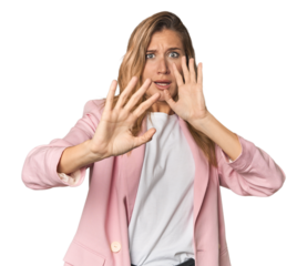 Young blonde in stylish pink suit being shocked due to an imminent danger