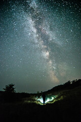 Night sky in forest . Beautiful summer night . Space over the forest and trees . Milky Way on the background . 