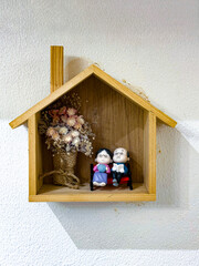 A beautiful combination of minimalist and rustic home decor featuring white and wooden shelves with...