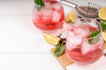Hibiscus margarita drink with ice, lime and mint