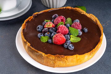 Homemade cheesecake with chocolate and berry