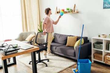 A man meticulously cleans the living room floor.
