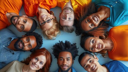 Diverse group of people smiling and looking up, forming a circle.