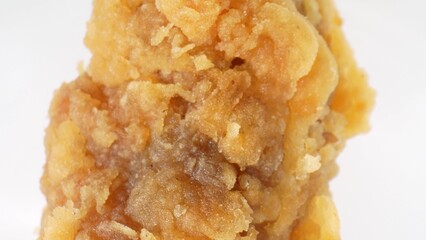 Crispy Temptation: In awe as hot fried chicken crackles with irresistible texture and flavor, perfectly captured in this tantalizing macro. Processed food background. 
