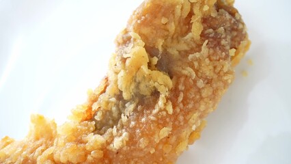 Close-up Macro Magic: Dive into the world of fried chicken as crispy skin crackles, golden hues...