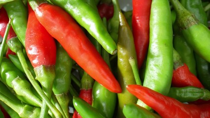 The world of colorful chili peppers with this macro. Explore the graceful curves and dynamic play of light and shadow, revealing their captivating beauty. Fruit and vegetable concept. 
