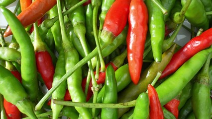 Searing sensation: Experience the intense beauty of colorful chili peppers up close, where their fiery essence comes to life in this mesmerizing macro. Food concept. 
