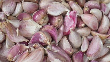 Marvel at the intricate textures of garlic cloves in this mesmerizing macro. Every detail, from papery skin to pungent aroma. 
