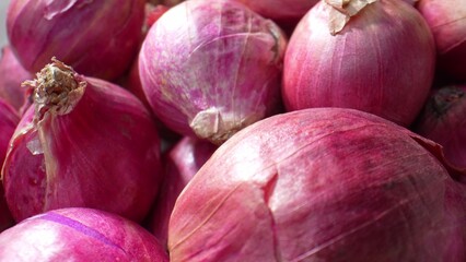 Dive into the hidden world of red shallots through this macro, where every detail, from their delicate skin to vibrant red, reveals nature's enchanting secrets. 
