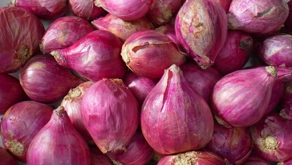 Explore the fascinating world of red shallots in stunning macro. Witness their delicate layers,...