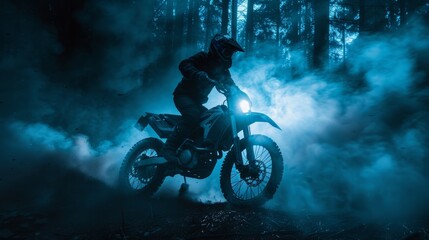 Motorcyclist riding through misty, dark forest surrounded smoke at night. Silhouette of bike and rider.