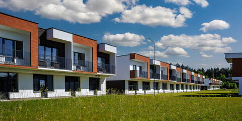 modern low-rise residential townhouse or public buildings complex with several multi-level apartments with isolated entrances