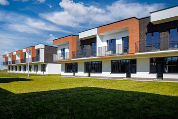 modern low-rise residential townhouse or public buildings complex with several multi-level apartments with isolated entrances