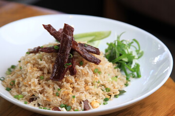 Homemade special Thai Fried Rice with Sun-dried meat, fried with oil, used on medium heat, not cooked until crispy.