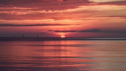 Evening Elegance Sunset Over the Sea in Subdued Tones