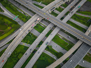 Fototapeta premium Aerial transport asphalt city junction road green tree forest park
