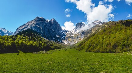 Fototapeta premium Panoramic view of some mountains with some snow on the top (Artiga de Lin, Vall d'Aran, Spain).