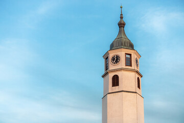 iconic Sahat Kula clock tower stands tall against the blue sky in Kalemegdan, Belgrade.