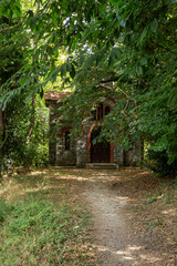 Small, stone church in the forest (Greece; Pelion)