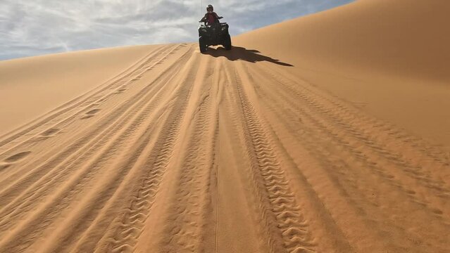 Quad in the dunes of the sahara