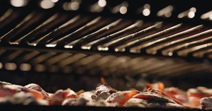 Grill, heated by burning coals, is perfect platform for preparing delicious feast. Smooth movement along grill grate ensures even cooking, and distinctive smell of hot coals enhances sensation. AD