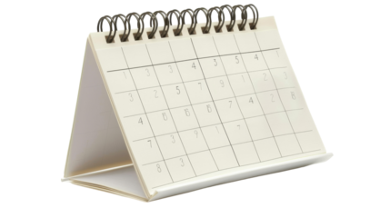 A white desk calendar featuring spirals on its pages, sitting on a desk