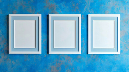 Three simple white frames on a saturated blue wall, embodying modern minimalism.