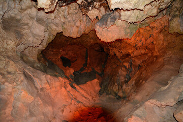 a large cave with a hole in it close up