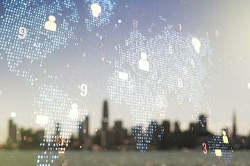 Double exposure of social network icons hologram and world map on blurry cityscape background....