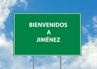 Siguiente salida Bienvenidos a jimenez una señal verde sobre fondo de cielo azul. Colección de señales de tráfico conceptuales