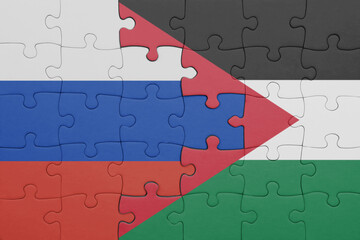 puzzle with the colourful national flag of jordan and flag of russia.