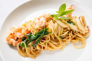 Stir-fried spaghetti with shrimp and squid