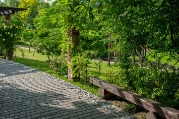 Summer in a landscape park...Trees and bushes in green clothes.