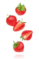 Whole and half strawberry with leaf and half slice flying in the air isolated on white background.