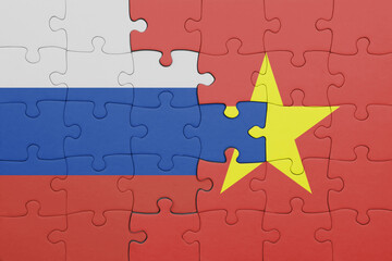 puzzle with the colourful national flag of vietnam and flag of russia.