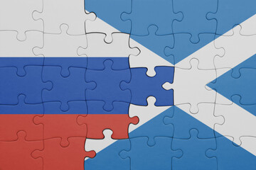 puzzle with the colourful national flag of scotland and flag of russia.