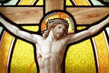A stained glass of Jesus on cross. Sanctuary Notre-Dame de La Salette, France.  Vitrail de Jésus...