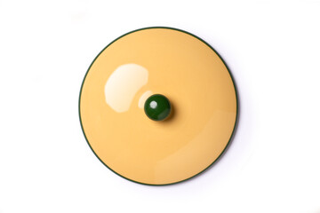 Yellow ceramic saucepan lid isolated on white background with clipping path, top view, flat lay