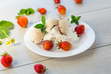 fresh organic cottage cheese with strawberries and ice cream in a plate on a wooden table