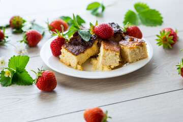 prepared cottage cheese casserole with fresh strawberries